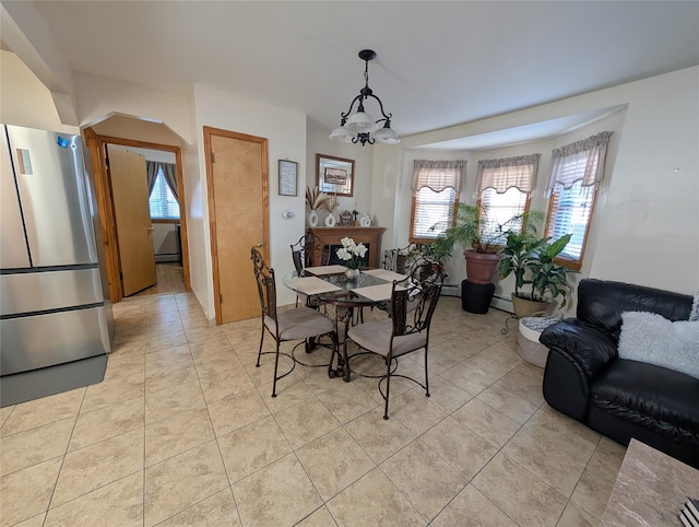 tiled dining space with a notable chandelier