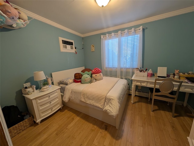 bedroom featuring an AC wall unit, crown molding, and light wood-type flooring