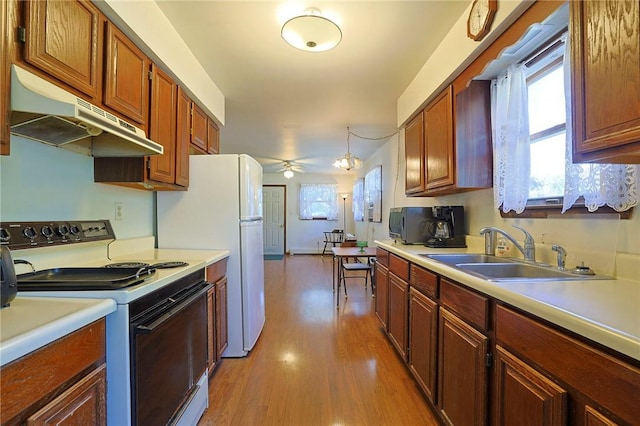 kitchen featuring sink, light wood-type flooring, ceiling fan, and white electric range oven