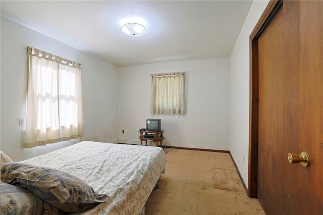 bedroom with light colored carpet and a closet