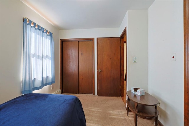 bedroom featuring a baseboard radiator and carpet floors