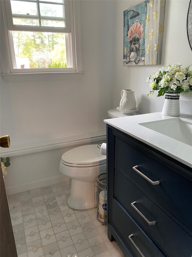 bathroom with vanity and toilet