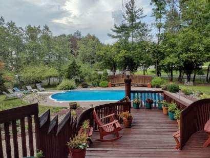 view of swimming pool with a deck