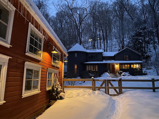 view of snow covered house