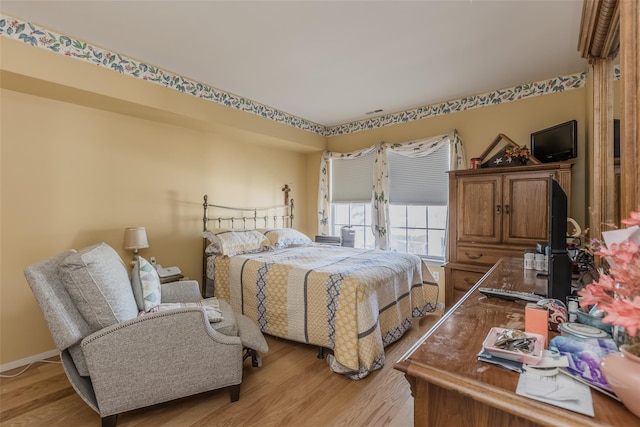 bedroom featuring light hardwood / wood-style floors