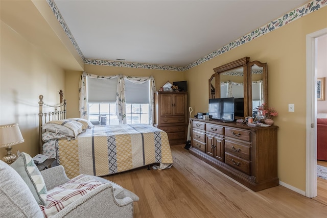 bedroom with light hardwood / wood-style flooring