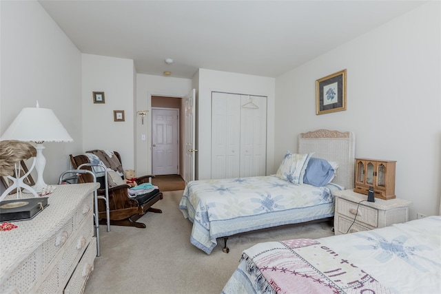 carpeted bedroom with a closet