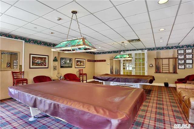 recreation room with a paneled ceiling, carpet flooring, and billiards