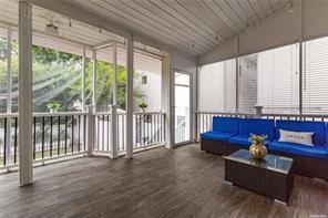 sunroom with lofted ceiling and wood ceiling