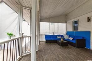 unfurnished sunroom with vaulted ceiling and wood ceiling