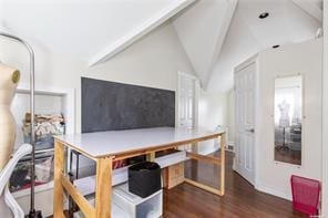 office space featuring vaulted ceiling and dark wood-type flooring