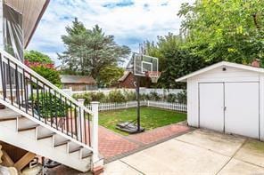 view of patio / terrace featuring a storage shed