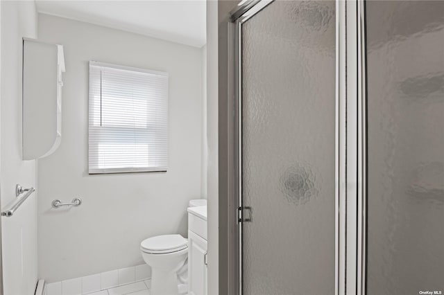 bathroom with tile patterned flooring, a baseboard heating unit, an enclosed shower, toilet, and vanity