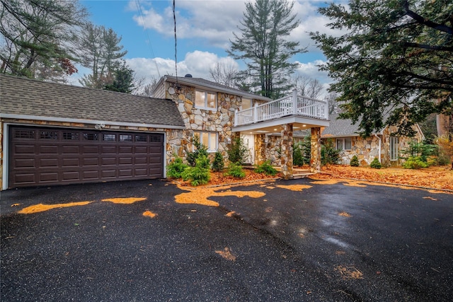 view of front of house featuring a deck and a garage