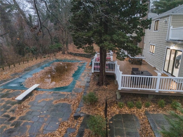 view of swimming pool featuring a deck