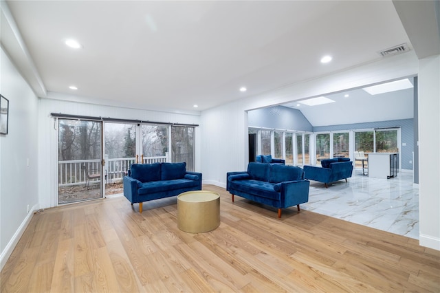 living room with light wood-type flooring and lofted ceiling