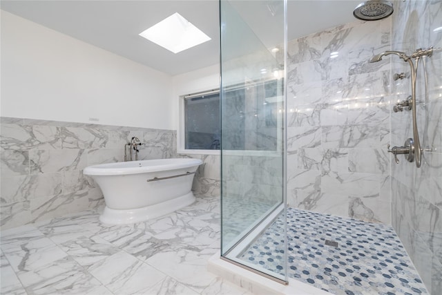 bathroom with a skylight, plus walk in shower, and tile walls