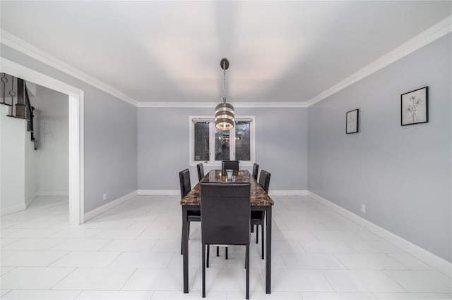 dining area with crown molding and a notable chandelier