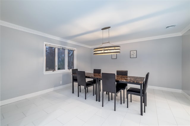 dining room featuring ornamental molding