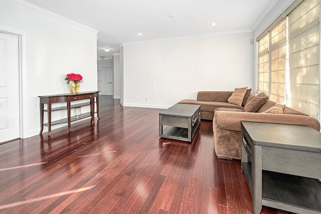 living room featuring dark hardwood / wood-style flooring and crown molding