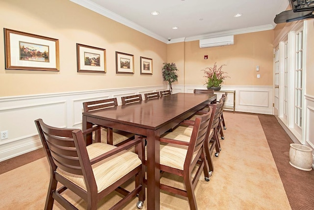 carpeted dining space with an AC wall unit, ornamental molding, and french doors