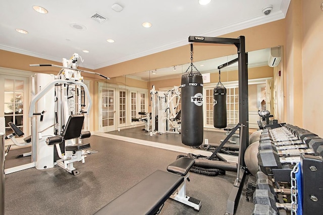 exercise room with a wall mounted air conditioner and crown molding