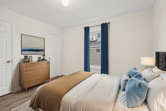 bedroom with hardwood / wood-style flooring