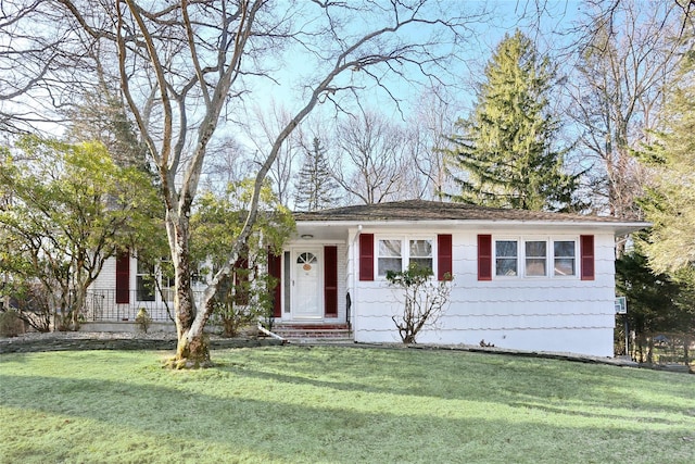 ranch-style house with a front yard