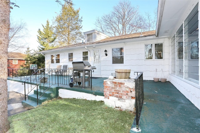 back of property featuring a patio area