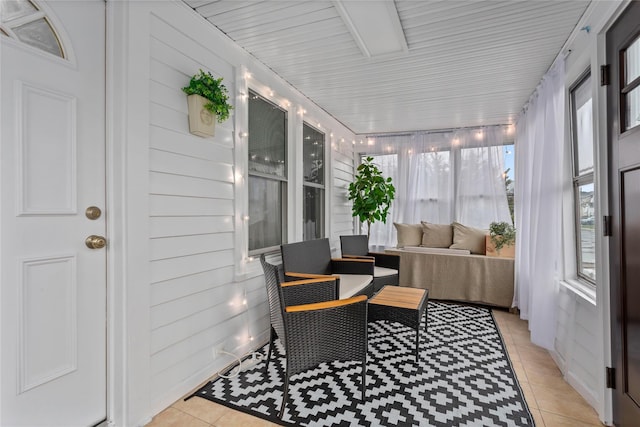 sunroom / solarium featuring a wealth of natural light