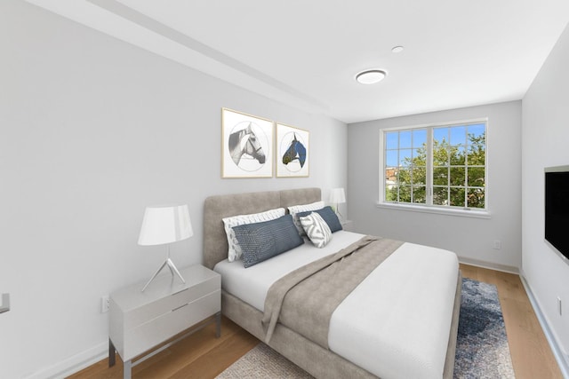 bedroom with hardwood / wood-style flooring