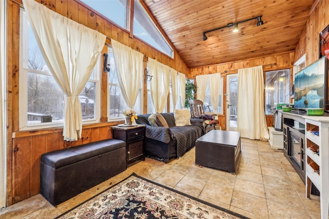 sunroom / solarium with rail lighting, wooden ceiling, and vaulted ceiling