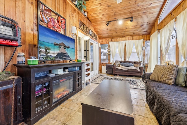 living room with wooden walls, wooden ceiling, and vaulted ceiling