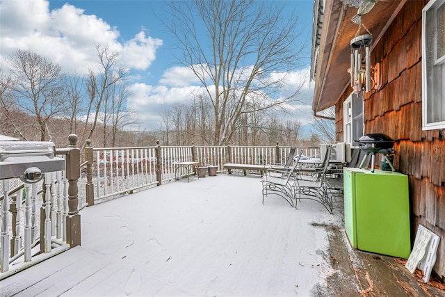 view of snow covered deck