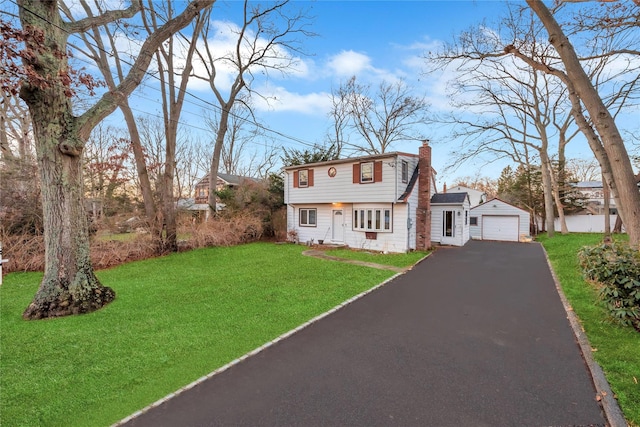 view of front facade with a garage and a front lawn