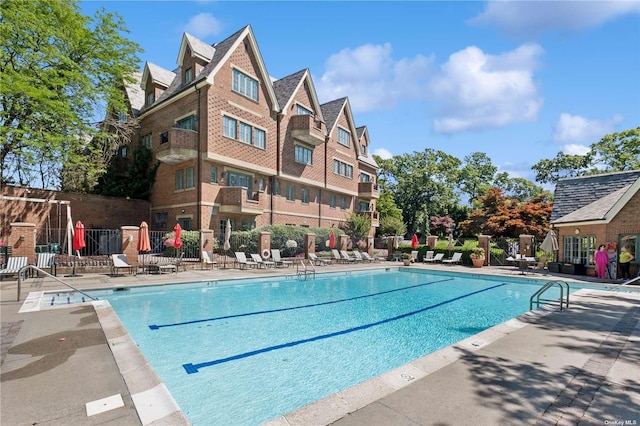 view of swimming pool with a patio