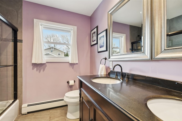 full bathroom with tile patterned floors, vanity, a baseboard radiator, enclosed tub / shower combo, and toilet