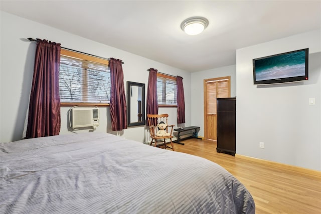 bedroom with wood-type flooring