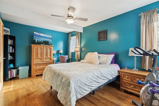 bedroom with light wood-type flooring and ceiling fan