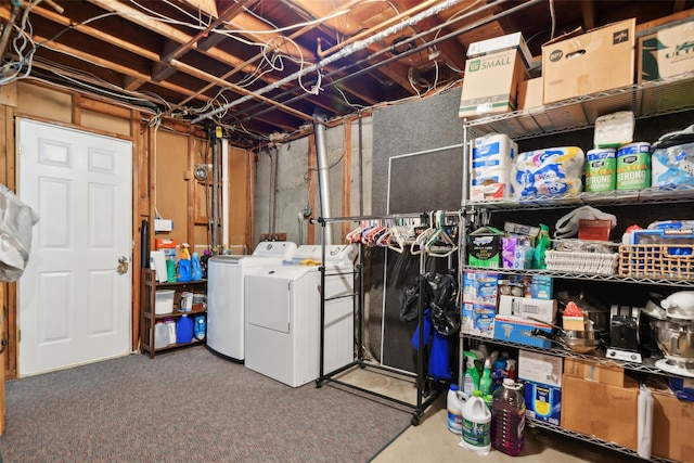 basement featuring washing machine and dryer and carpet floors