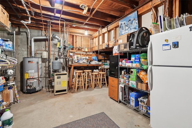 basement featuring white fridge and gas water heater