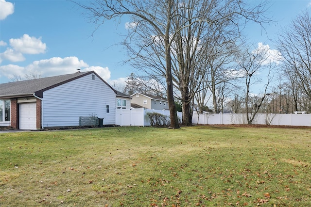 view of yard with a garage