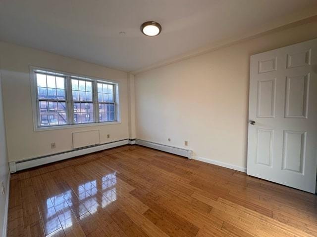 unfurnished room with light hardwood / wood-style flooring