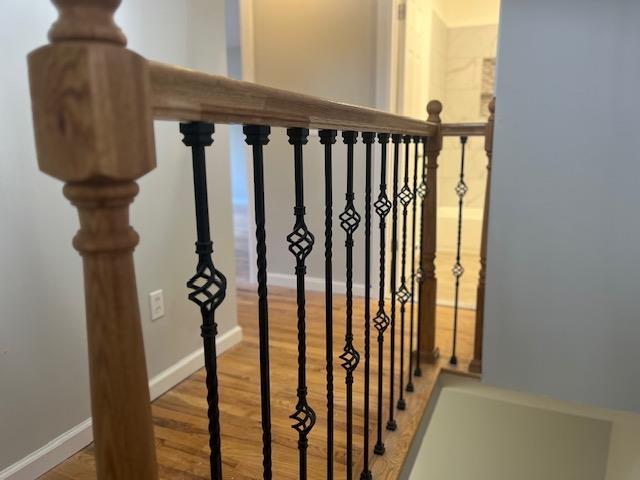 stairway featuring hardwood / wood-style flooring