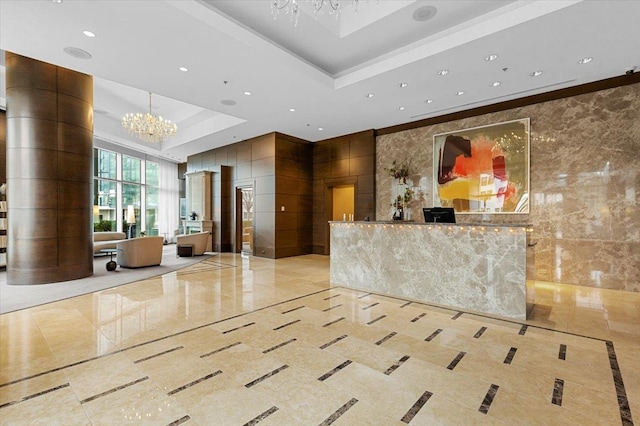 reception area featuring a chandelier