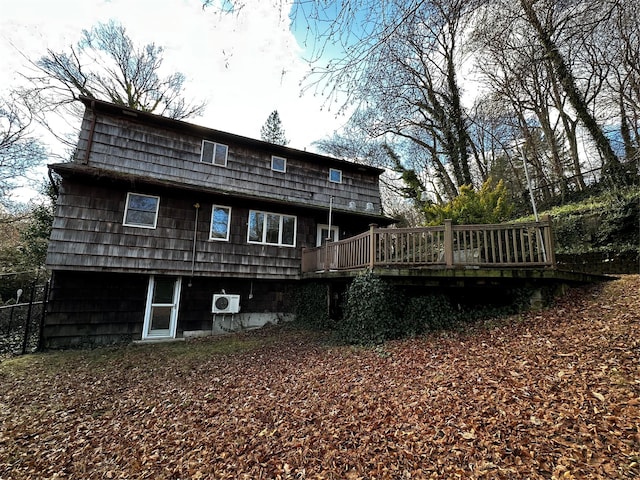 back of house featuring a deck