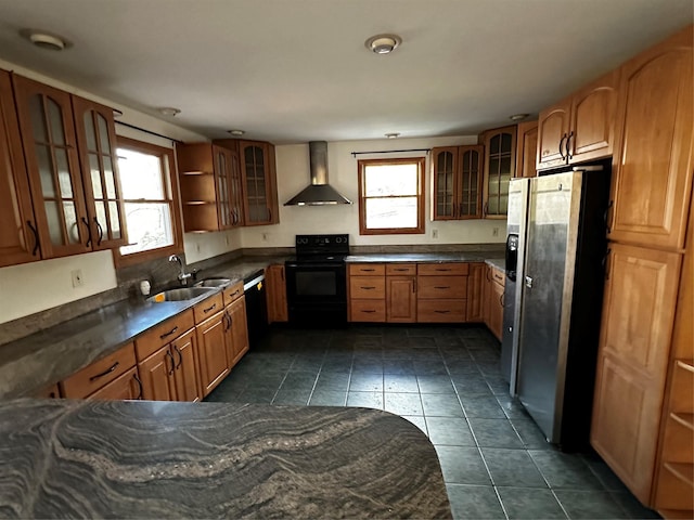 kitchen with black appliances, dark tile patterned floors, wall chimney range hood, and sink