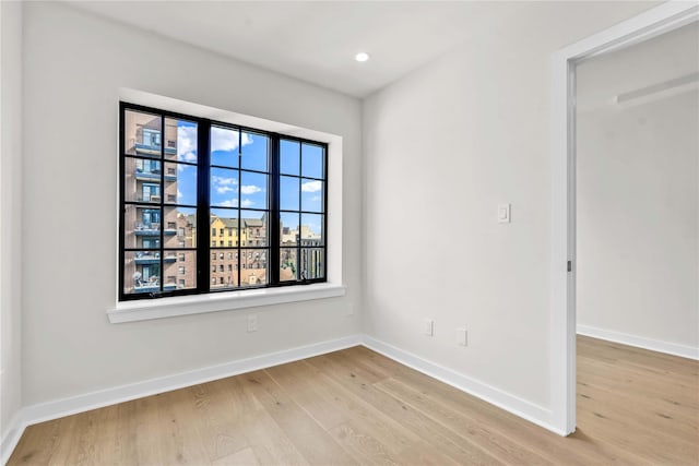 unfurnished room featuring light wood-type flooring