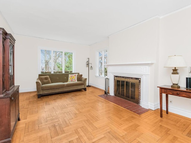 living room featuring light parquet flooring and a brick fireplace