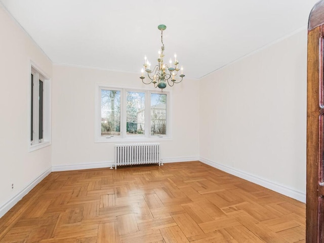 unfurnished dining area featuring an inviting chandelier, light parquet floors, and radiator